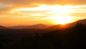 Clarksburg skyline at sunset featuring vibrant colors and silhouetted trees.